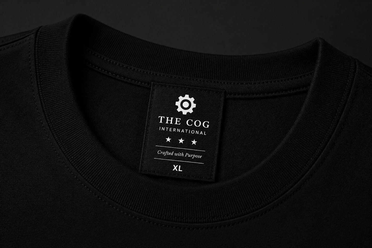 Neck label detail reading THE COG International, Crafted with Purpose